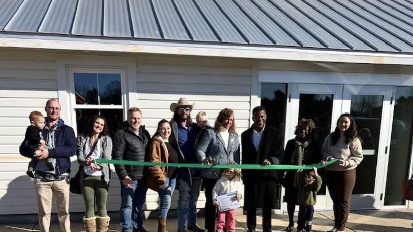 The Giving Tree Montessori School community gathered for the opening-day ribbon cutting.