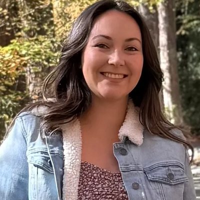 Jessah Logan-Magnusson, Lead Toddler Teacher — smiling woman outdoors wearing a denim jacket with a fleece collar.