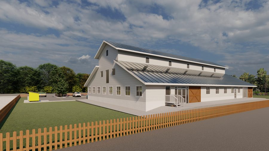 Architectural rendering of The Giving Tree Montessori School: a long barn-form building with clapboard siding, a standing-seam roof, clerestory vents and sliding barn doors, seen from the parking area with marked bays in the foreground.