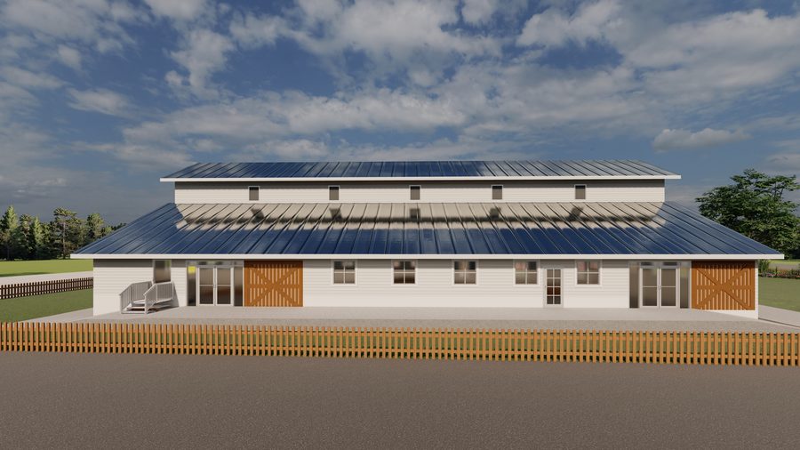 Architectural rendering of The Giving Tree Montessori School: a long barn-form building with clapboard siding, a standing-seam roof, clerestory vents and sliding barn doors, from the parking area looking along the front elevation to the pavilion.
