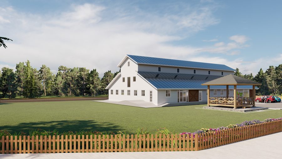 Architectural rendering of The Giving Tree Montessori School: a long barn-form building with clapboard siding, a standing-seam roof, clerestory vents and sliding barn doors, a side elevation showing the run of windows beneath the sweeping roof.